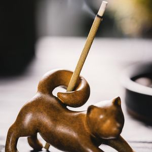 Incense burning on a small decorative table.